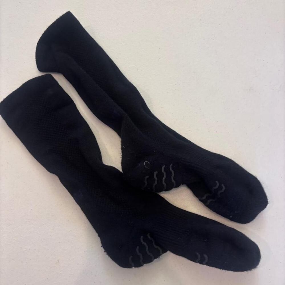 Apollo grip socks with wavy gray stripes on the sole